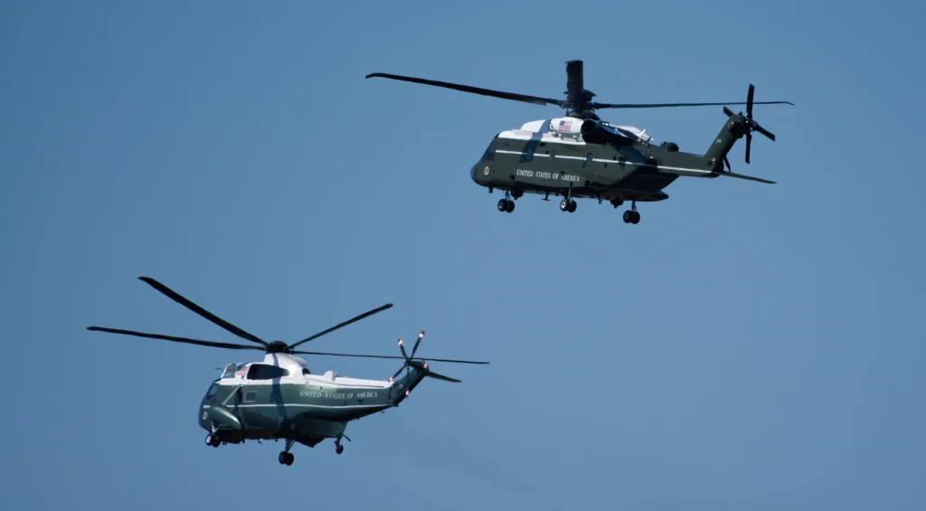 Two generations of presidential HMX-1 Sikorsky aircraft - VH-3D lower altitude, VH-60N upper - over Delaware September 9, 2024.